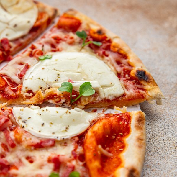 Pizza goat cheese, tomato sauce, bacon tasty food dish fresh delicious gourmet food background on the table rustic food top view copy space top view